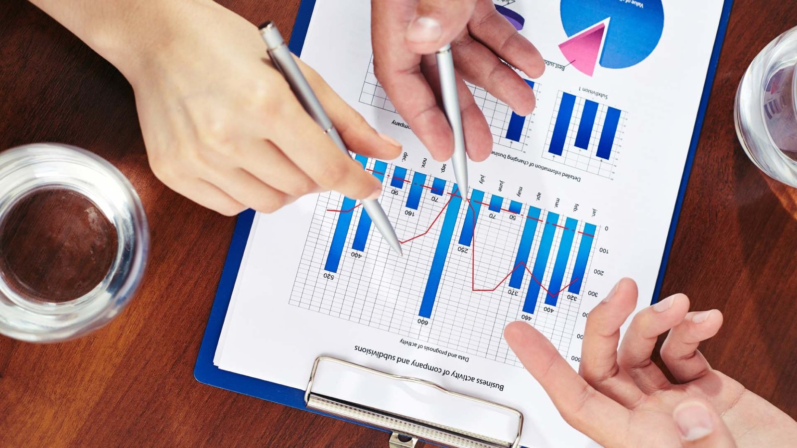 Real estate investors reviewing lead scores on REsimpli platform.