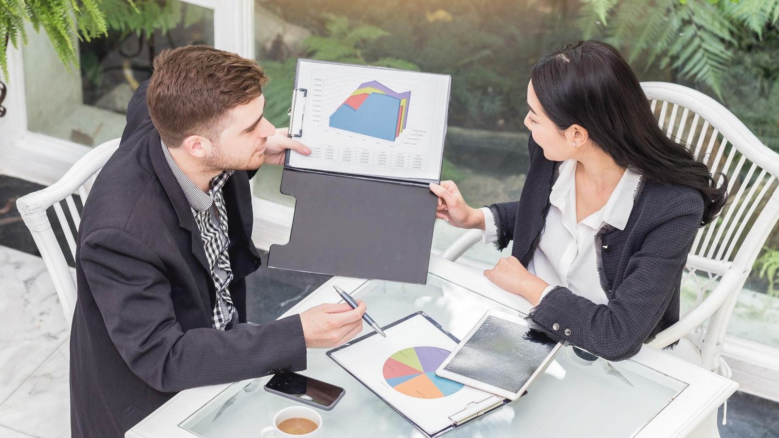 Business analysts examining Ericsson’s network optimization data for strategic expansion.