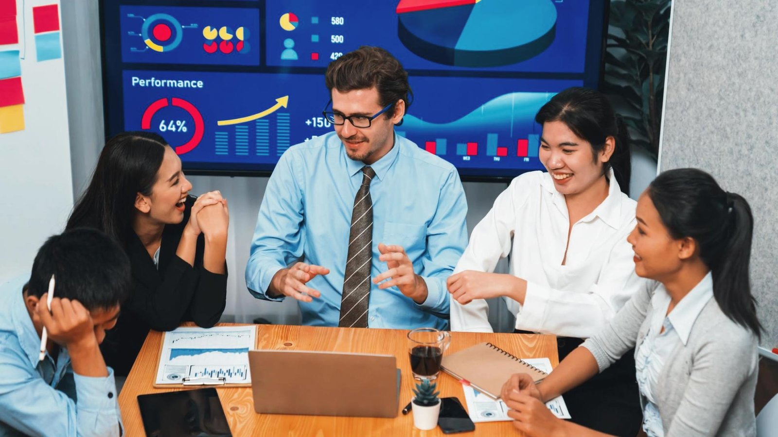 Team collaborating on digital marketing strategy using 5G-powered data analytics and real-time performance dashboards.